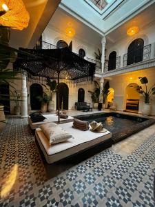 a large room with a pool in a building at Maison Dar Saada in Marrakesh
