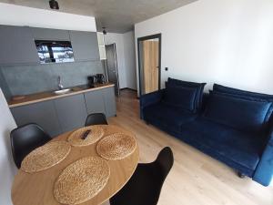 Posezení v ubytování APARTAMENTY PIASKOWE BŁĘKITNA