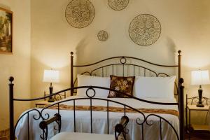 Postel nebo postele na pokoji v ubytování Hacienda San Nicolas de las Fuentes