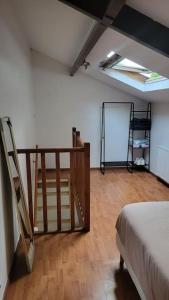 a room with a bed and a chalkboard on the wall at Maisonnette en duplex - jardin in Noisy-le-Grand
