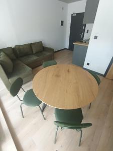 Posezení v ubytování APARTAMENTY PIASKOWE BŁĘKITNA