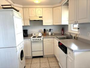 A kitchen or kitchenette at First Floor Ocean Front Duplex In Ship Bottom