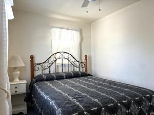 A bed or beds in a room at First Floor Ocean Front Duplex In Ship Bottom
