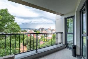 a balcony with a view of a city at Boutique 1 bedroom apartment with Private Parking and Port View in Varna City