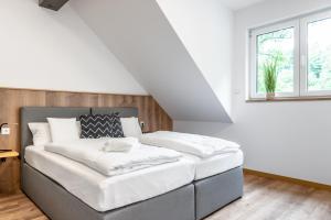 Postel nebo postele na pokoji v ubytování Heilsteinlodge