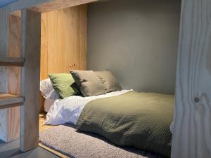 a bedroom with a bed with pillows on it at 3 Bedroom Penthouse Apartment in Manchester