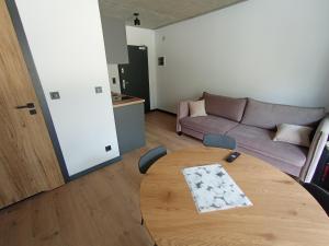 Posezení v ubytování APARTAMENTY PIASKOWE BŁĘKITNA