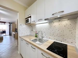 a kitchen with a sink and a counter top at Studio Sun Marina in Sozopol