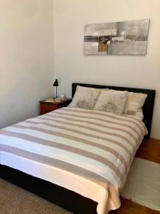 Postel nebo postele na pokoji v ubytování City apartment Amfora