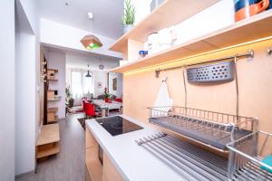 a kitchen with a sink and a stove at Bulrock Residance in Sofia