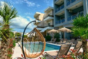 a swing by a pool at a hotel at Miami apartments in Ulcinj