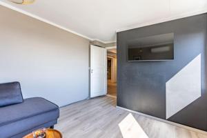 TV a/nebo společenská místnost v ubytování Aurora Lodge Skarsvåg