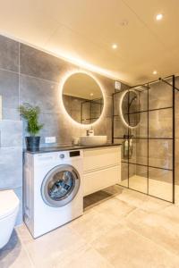 Koupelna v ubytování Aurora Lodge Skarsvåg + 14 fotografií