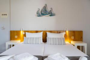 A bed or beds in a room at Medousa Studio & Apartments