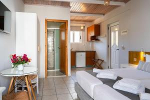 A bed or beds in a room at Medousa Studio & Apartments