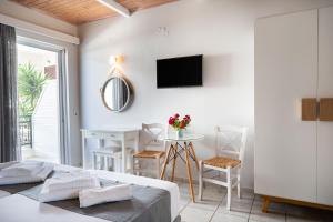 A bed or beds in a room at Medousa Studio & Apartments