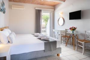 A bed or beds in a room at Medousa Studio & Apartments
