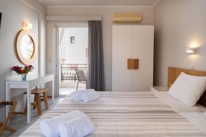 A bed or beds in a room at Medousa Studio & Apartments
