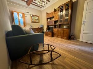 a living room with a couch and a coffee table at Antico Borgo - Appartamento in Cavriglia