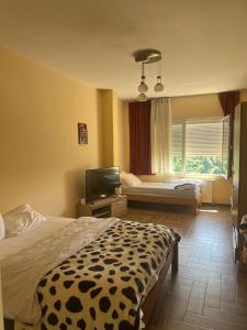 En eller flere senge i et værelse på Villa Guci