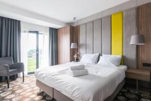 Ένα ή περισσότερα κρεβάτια σε δωμάτιο στο Rentsite Family Apartments Ex Baltin Hotel