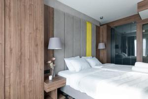 Ένα ή περισσότερα κρεβάτια σε δωμάτιο στο Rentsite Family Apartments Ex Baltin Hotel +27 φωτογραφίες