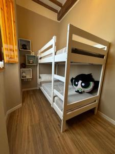 a bunk bed with a cat toy on the bottom bunk at Antico Borgo - Appartamento in Cavriglia