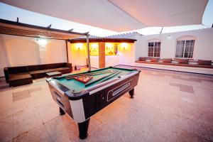 a pool table in a large room with a pool table at Casa La Loma in Granada +35 photos