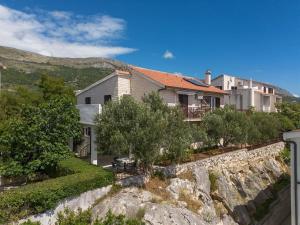a house on the side of a mountain at Holiday Home Prančević in Podstrana