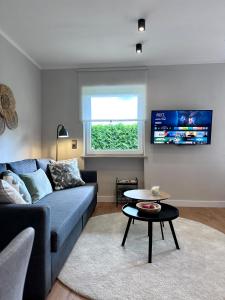 TV a/nebo společenská místnost v ubytování Business l WLAN l Boxspring I Parkplatz I Komfort
