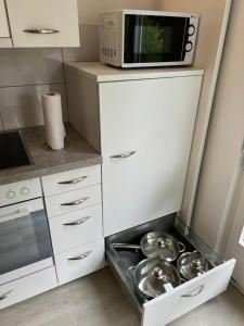 Kuchyň nebo kuchyňský kout v ubytování Apartment TOM