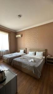 Postel nebo postele na pokoji v ubytování Hotel RichI G A