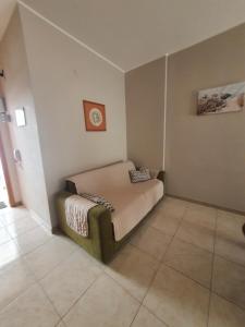 a bedroom with a bed in the corner of a room at POLA 4 in Ginosa Marina