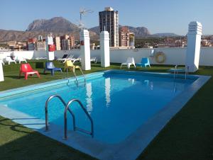 a swimming pool on the roof of a building at Fleming Playa Poniente in Benidorm