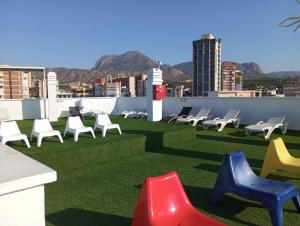 a group of chairs sitting on top of a roof at FLEMING PLAYA PONIENTE in Benidorm