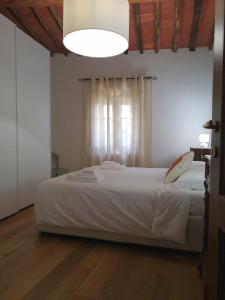 Ein Bett oder Betten in einem Zimmer der Unterkunft Borgo dei vigneti