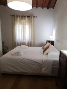 Ein Bett oder Betten in einem Zimmer der Unterkunft Borgo dei vigneti