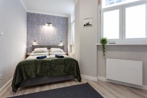Voodi või voodid majutusasutuse Buda Castle Serpentine Apartments toas