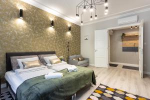 Voodi või voodid majutusasutuse Buda Castle Serpentine Apartments toas