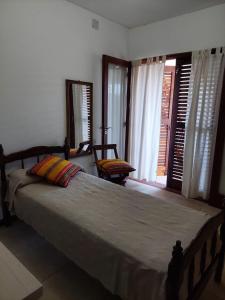 a bedroom with a large bed and a window at Casa Bella Vista in Salta