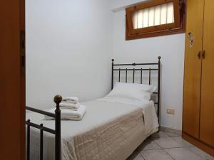 Postelja oz. postelje v sobi nastanitve Villetta a Marzamemi a 50m dal Mare