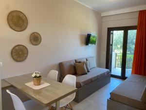 a living room with a couch and a table at Casa Marina in Syvota