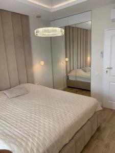 Postel nebo postele na pokoji v ubytování Apartament Stranda Residence 302 B Mazury Giżycko