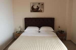 Postel nebo postele na pokoji v ubytování Sofotel