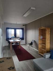 a living room with a table and a chair at Odd inge Sør-Reime as in Nesseby