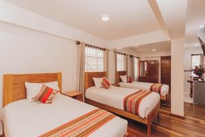 Postelja oz. postelje v sobi nastanitve Quechua Hotel Cusco