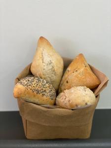 a bunch of different types of bread in a basket at Hollywood Hotel in Los Angeles