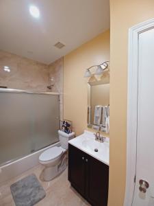 a bathroom with a toilet and a sink at Nice Luxury Suite in Brenda View