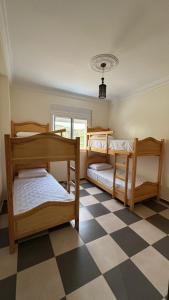 מיטה או מיטות בחדר ב-Appartement 3 vue sur mer à Azla