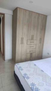 Uma cama ou camas num quarto em Hermosa Casa en Restrepo, Meta